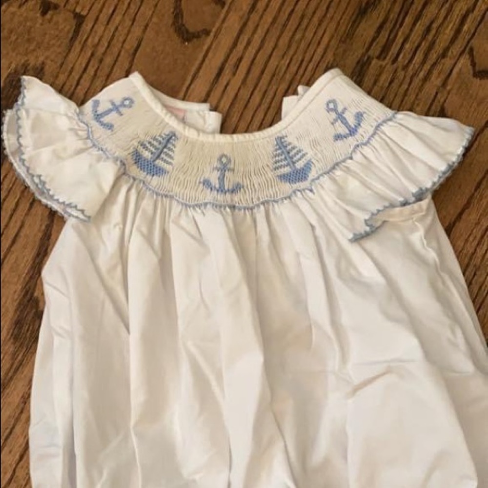 White petit Bebe sailboat bubble size 9M